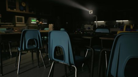 In a dimly lit classroom, a bright projector illuminates the space, casting shadows on empty blue chairs and desks. The atmosphere feels contemplative and serene.の写真素材