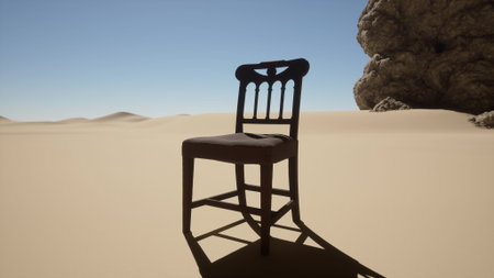 A tall, wooden chair with a simple design is positioned prominently on soft, sandy ground. The scene showcases an expansive desert with gentle dunes and a clear, blue sky.の写真素材