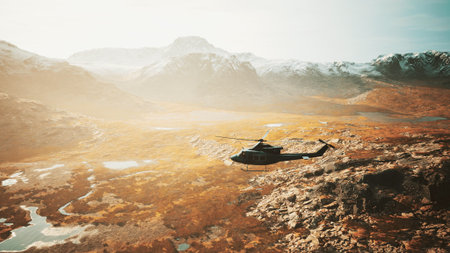 A helicopter soars through a breathtaking landscape, showcasing expansive valleys and shimmering lakes.の写真素材