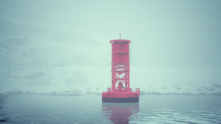 A red buoy made of metal sits in the cold Norwegian sea, surrounded by water.