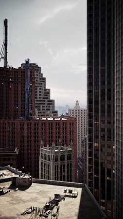 An aerial perspective of a cityscape seen from a high rise building, showcasing the urban landscape below.の写真素材
