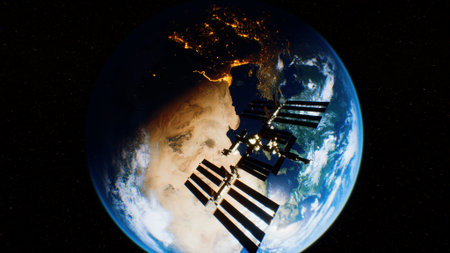 A stunning view of the International Space Station floating in space, with Earth visible below. The planets blues, greens, and browns contrast beautifully against the blackness of space.の写真素材