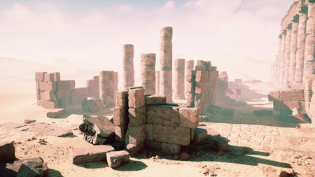 Crumbled columns and stone remnants lie scattered in a vast desert, bathed in warm light under a clear blue sky. The serene atmosphere evokes a sense of history and mystery.の写真素材