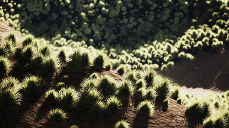 Vibrant patches of grass cover gentle hills, bathed in sunlight, creating a serene landscape....