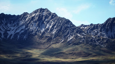 Towering peaks capture sunlight beneath a bright blue sky. Lush valleys and rugged terrain create a stunning natural landscape that inspires awe and tranquility.の写真素材