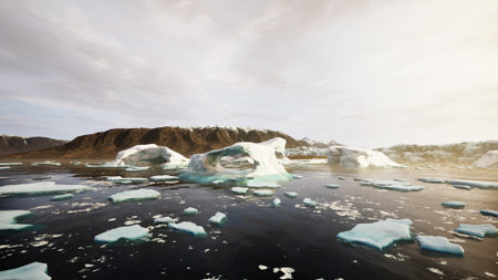 Majestic icebergs float in tranquil waters, surrounded by rugged mountains and a soft, light filled...