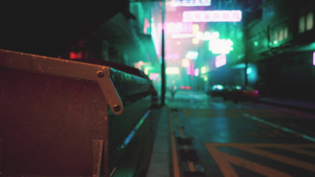 In a dim city street, neon signs glow brightly against the night sky, creating a surreal ambiance. A nearby dumpster adds contrast, enhancing the urban atmosphere.の写真素材