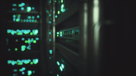 Vibrant green lights flicker as servers hum softly in a vast data center. Cables snake through metal racks, illuminating the dark space and showcasing advanced technology at work.の写真素材