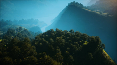 Breathtaking view of towering mountains enveloped in soft mist, with a peaceful river winding...