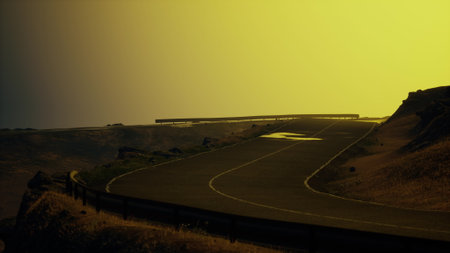As evening falls, a winding road twists through serene hills, bathed in a warm golden glow. The...