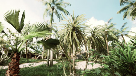 A vibrant display of tropical plants fills the foreground, with tall palm trees reaching for the sky.の写真素材