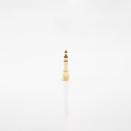 Female 3.5 mm to male TRS adapter on white background.の写真素材