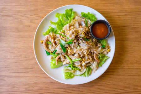 Stir-fried fresh rice-flour noodles with chicken and eggの写真素材