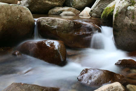 a mountain stream that flows through the rocks of a valley