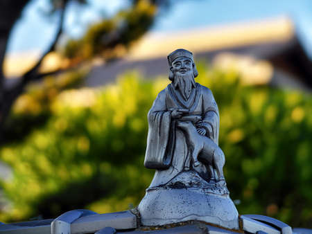 Seven Lucky Gods Standing on the Wall of a Templeの写真素材