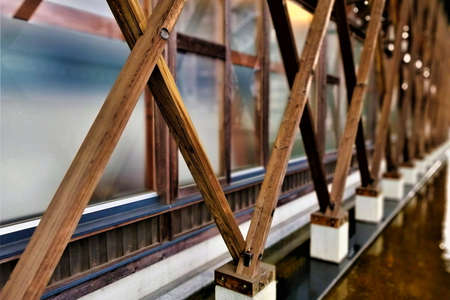 a wooden lattice set up along the exterior walls of a buildingの写真素材