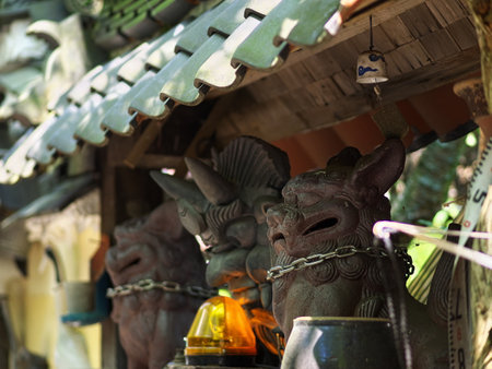 A guardian dog figurine seen on a mountain pathの写真素材
