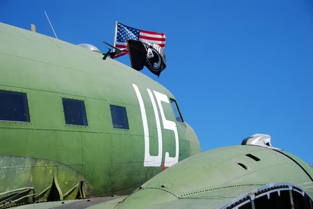 Vintage airplane saluting war heroes