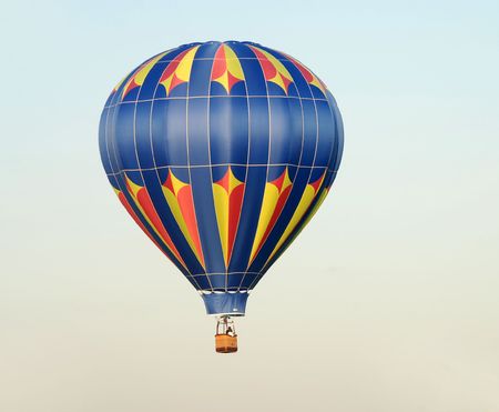 Colorful hot air balloon taking off at dawn                             の写真素材