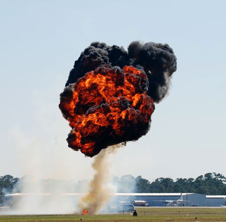 Fireball explosion above airfield                             