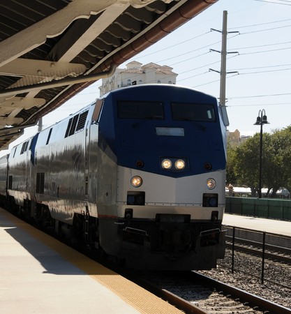 Modern passenger train arriving at platformの写真素材