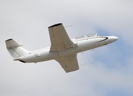 Early jet era training aircraft in flightの写真素材