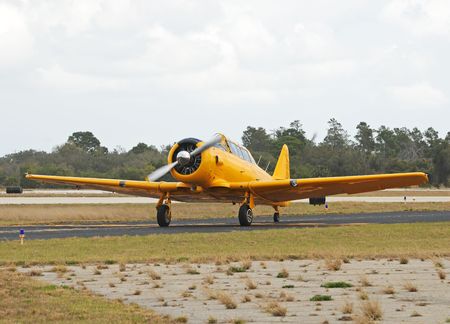 Vintage propelelr airplane in yellow color