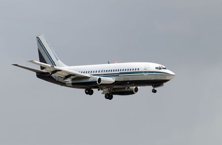 Retro passenger jet airplane minutes before landing