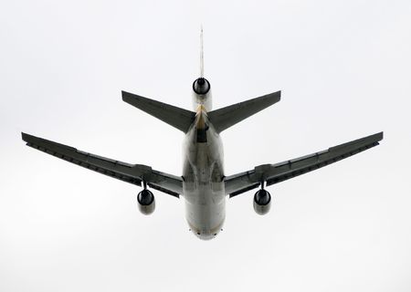 Heavy cargo jet airplane taking off rear view