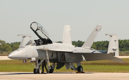 Navy jetfighter with folding wings preparing for flight