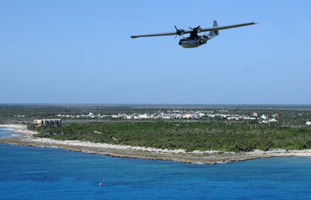 Seaplane flying over exotic Caribbean island