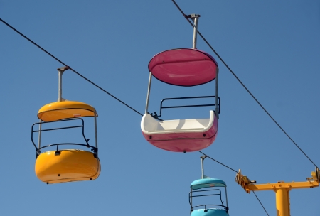Colorful gondola seats in amusement parkの写真素材