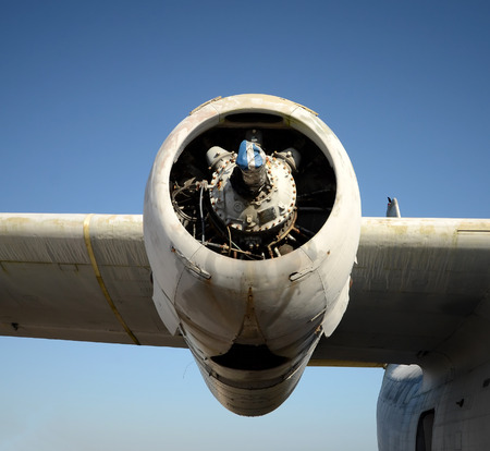 Broken old airplane engine  on a wing
