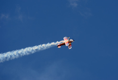 Light sports airplane performaing aerobatics