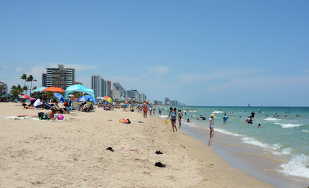 Fort Lauderdale, USA - May 19, 2013: Tourists and locals enjoy a sunny day on Fort Lauderdale Beach, Florida. it is a major tourist destination.のeditorial素材