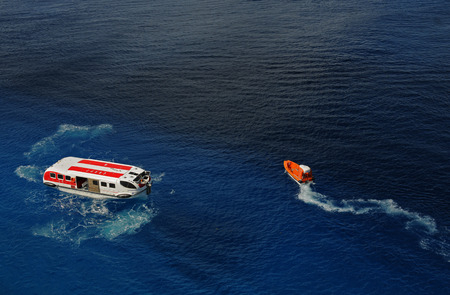 Cozumel, Mexico - December 16, 2010: The crew of cruise ship Norwegian Epic conducts safety drill for man overboard. Cruise ships are required to regularly conduct such emergency training.のeditorial素材