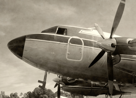 Retro propeller airplane nose view in stained black and white photoのeditorial素材