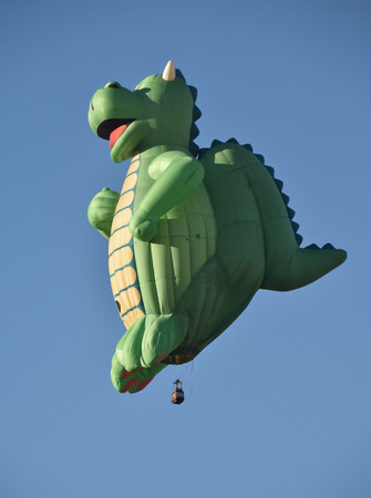 ALBUQUERQUE - OCTOBER 7: Dragon shaped hot air balloon takes flight during the International Balloon Fiesta in Albuquerque NM on October 7, 2016のeditorial素材