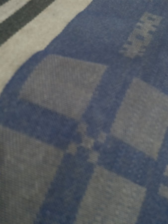 abstract background of blue checkered fabric, closeup of photo
