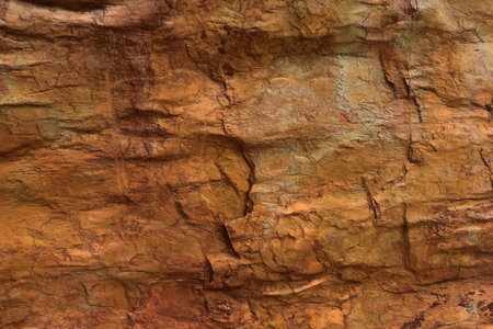Close up of red sandstone rock texture background. High resolution photo.の写真素材