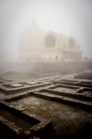 The misty morning at Parinirvana Stupa, the historic Buddhist sacred landmark at Kushinagar, India.の写真素材