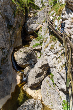 Mixnitz Barenschutzklamm, Styria / Austria - 18 05 2017: Waterfalls in Styria tourist attraction. Wooden bridge tourists on a hiking pathpathのeditorial素材