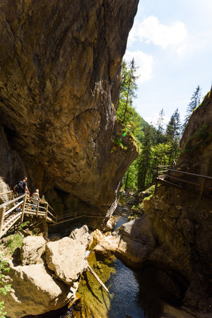 Mixnitz Barenschutzklamm, Styria / Austria - 18 05 2017: Waterfalls in Styria tourist attraction. Wooden bridge tourists on a hiking pathpathのeditorial素材