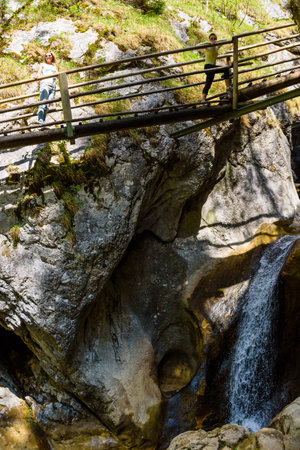 Mixnitz Barenschutzklamm, Styria / Austria - 18 05 2017: Waterfalls in Styria tourist attraction. Wooden bridge tourists on a hiking pathpathのeditorial素材