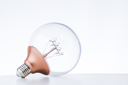 LED bulb on the white table with white background for eco saving conceptの写真素材