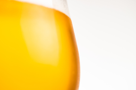 Glass of cold golden beer isolated on a white background. copy space for textの写真素材