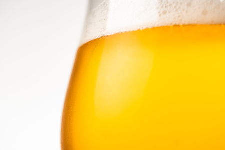 Glass of cold golden beer isolated on a white background. copy space for textの写真素材