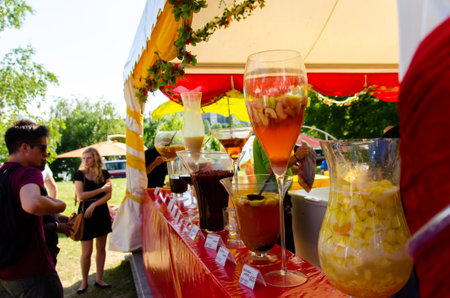 Vienna Austria - 22.06.2013: Stand with juices, fruit drinks on danube island. People enjoying summer sun on islandのeditorial素材