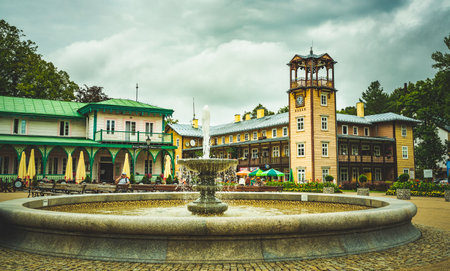 Iwonicz Zdroj, Poland - 13.08.2019: Old town in Poland Iwonicz Zdroj. View at town square, fountain and town hall. Tourist destinationのeditorial素材