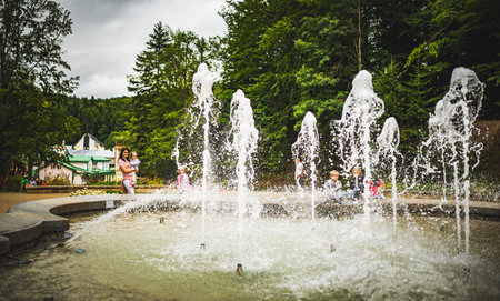 Iwonicz Zdroj, Poland - 13.08.2019: Old town in Poland Iwonicz Zdroj. View at fountain in gardens. Tourist destinationのeditorial素材